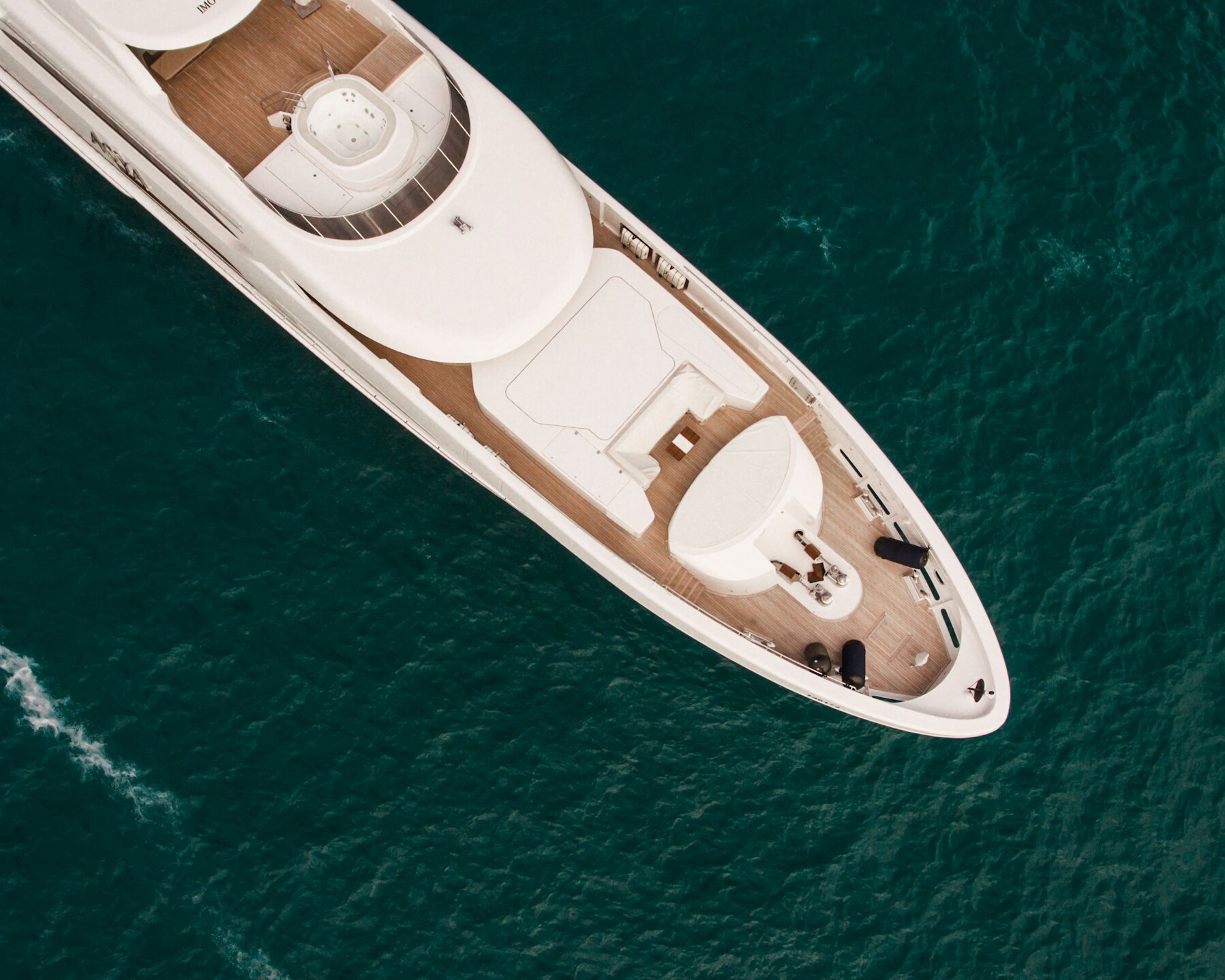 white and black boat on blue sea during daytime
