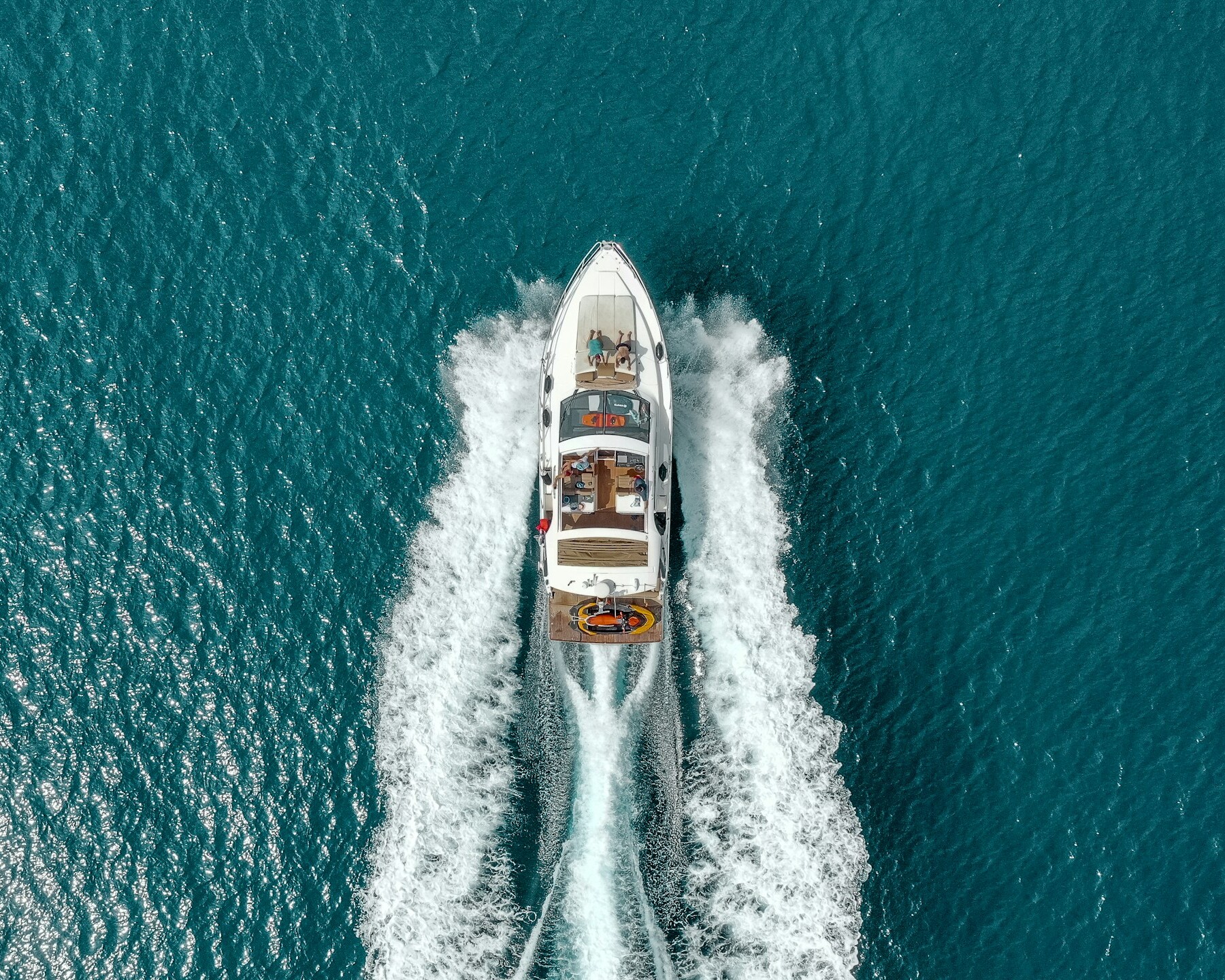 white and red boat on sea during daytime